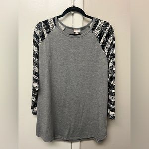 Woman’s LuLaRoe baseball-style jersey shirt.